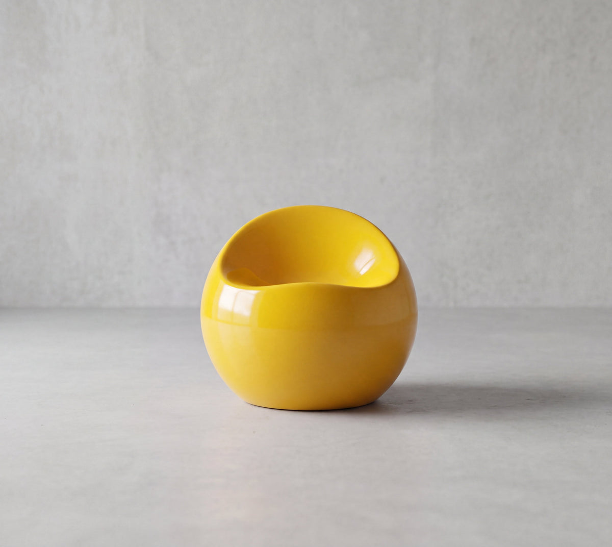PACCO Low Chair – low sculptural lounge chair, front view