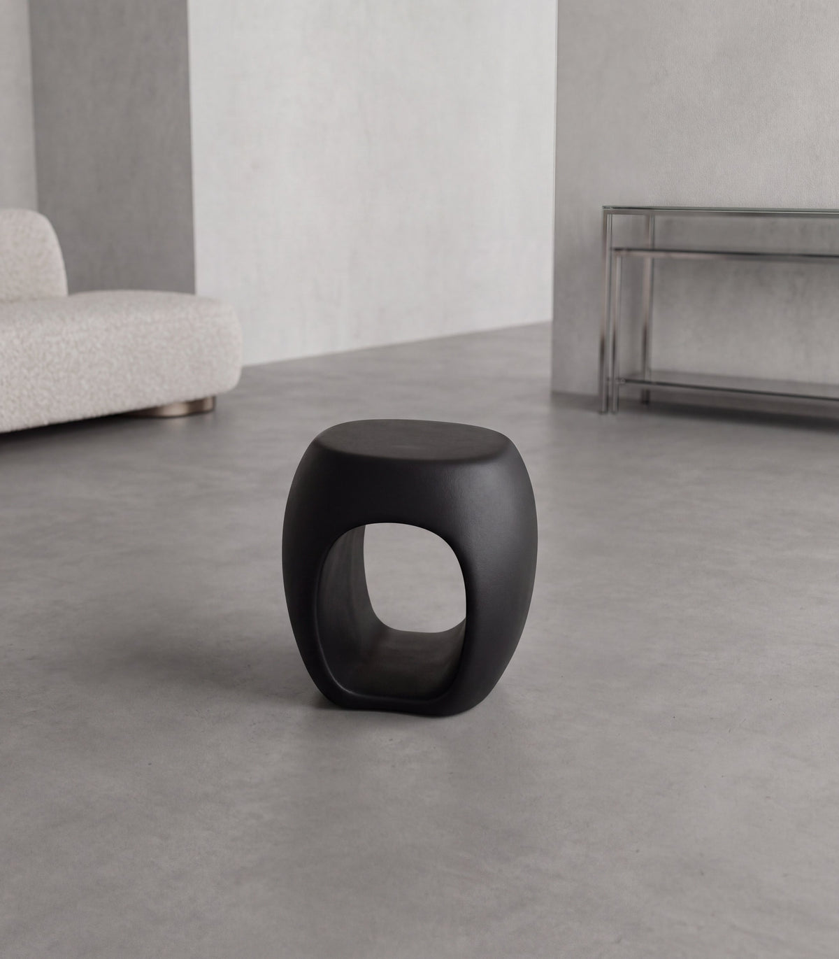 MALO Side Table – compact matte black fiberglass side table with an irregular central opening