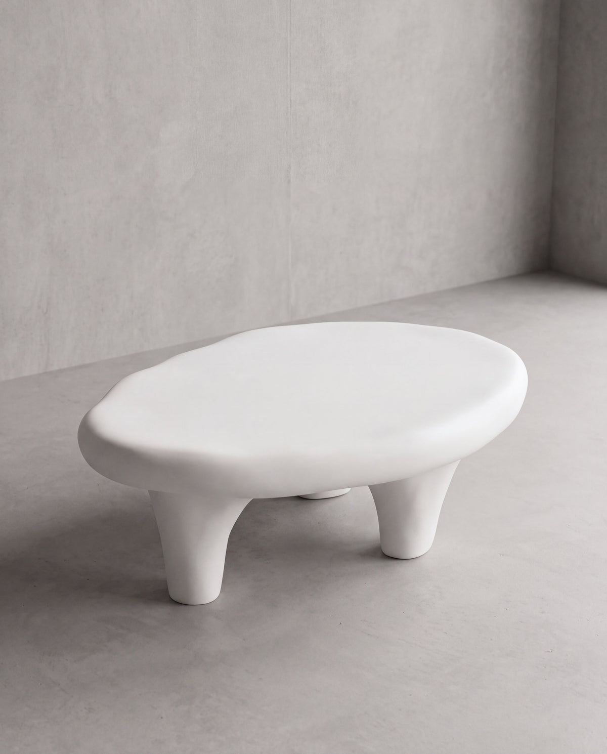 NUBA Coffee Table – low sculptural matte white fiberglass coffee table with soft irregular lines