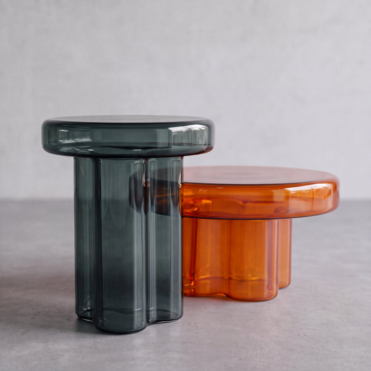 AURELIO amber acrylic coffee table and MIST blue-grey acrylic stool shown side by side